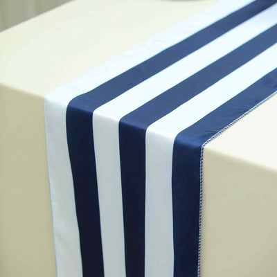 Navy and white striped table runner on a beige table