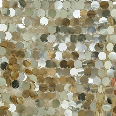 Gold and silver sequin fabric with shimmering circular sequins.