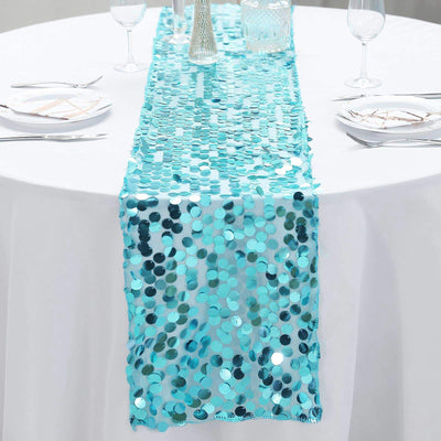 Turquoise sequin table runner on a white table setting