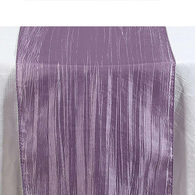 Purple textured table runner on a white surface.
