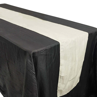Black and white table runner on a dark table