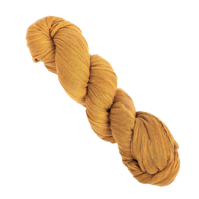 Mustard yellow twisted fabric bundle on a plain background