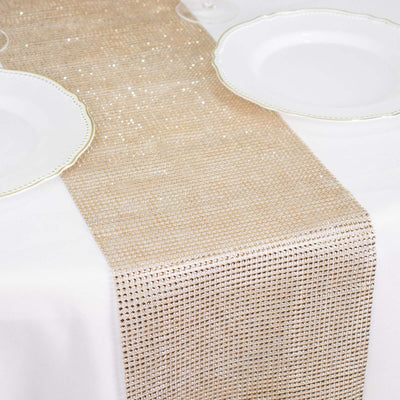 Elegant gold sequin table runner on a white table setting.