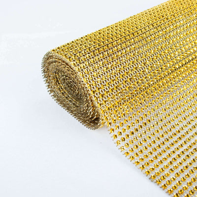 Gold mesh fabric roll on white background