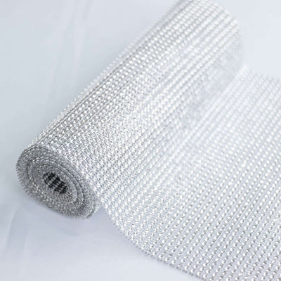 Roll of sparkling silver rhinestone mesh fabric
