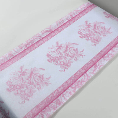 Floral patterned wrapping paper in pink and white tones.