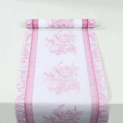 Pink floral patterned wrapping paper roll on a white background.