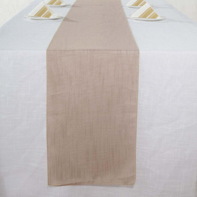 Beige table runner on a white tablecloth