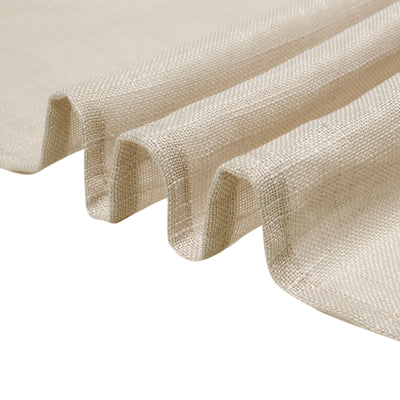 Beige textured fabric with soft folds and drapes.