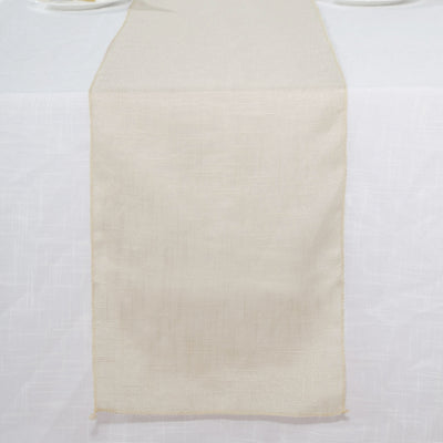 Beige table runner on a white tablecloth