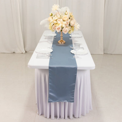 Table set with a floral centerpiece and elegant tableware.