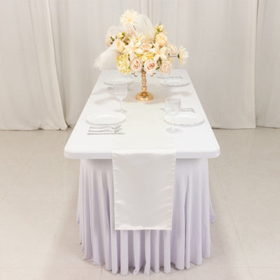 Elegant table setting with floral centerpiece and glassware.