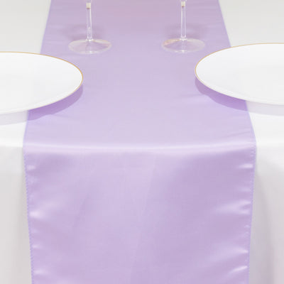 Lavender table runner on a dining table with plates and glasses