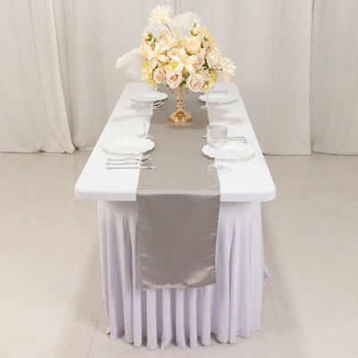 Elegant table setting with floral centerpiece and polished dinnerware.