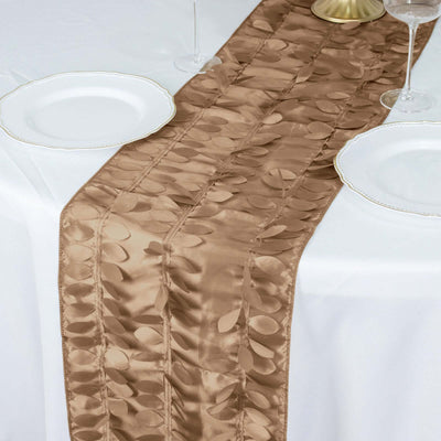 Elegant beige table runner with leaf patterns on a white table setting.