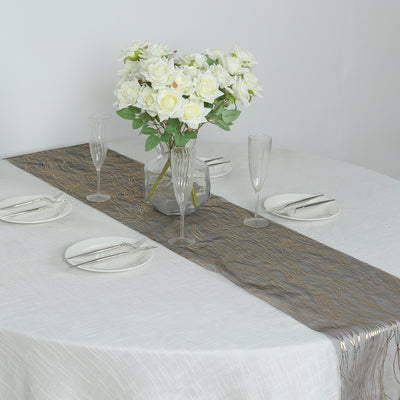 Elegant gray table runner with gold accents on a dining table setup.