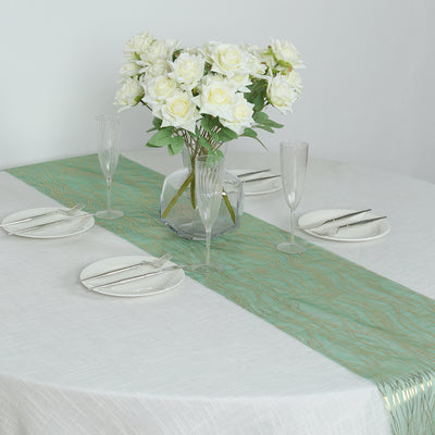 Elegant table setting with green runner and white roses in a vase.