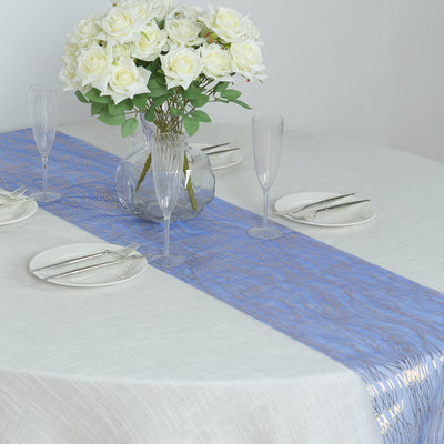 Elegant blue table runner with gold accents on a decorated dining table.