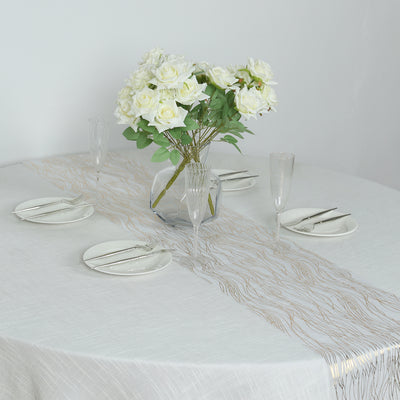 Elegant table setting with white roses and decorative plates.