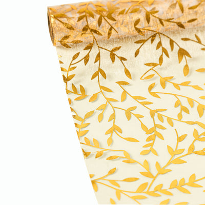 Gold leaf patterned wrapping paper roll on a white background