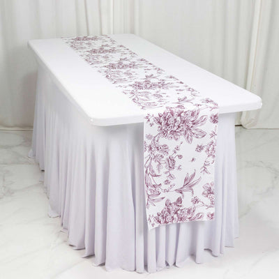 White tablecloth with floral table runner on rectangular table