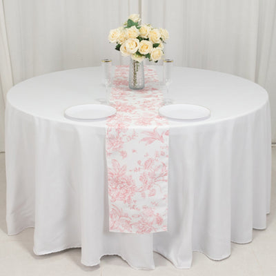 Elegant floral table runner on a round table with champagne glasses and roses.
