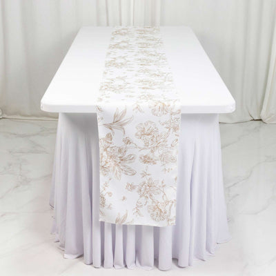 White floral table runner on a lavender round table with matching table skirt