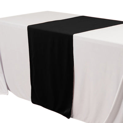 Black table runner on a white tablecloth