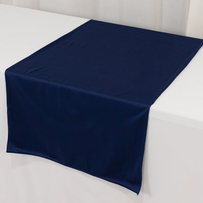 Navy blue table runner on a white table surface