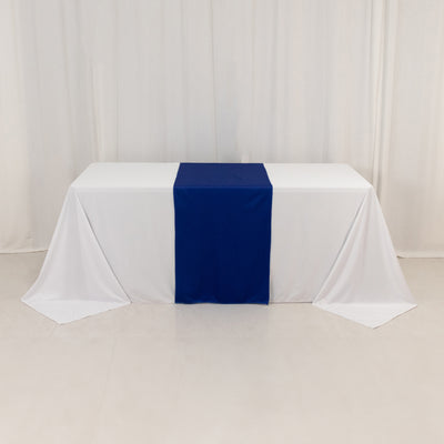 White table with a blue runner on a plain background.