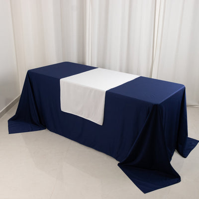 Navy blue tablecloth with white center panel on a table