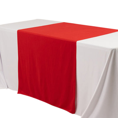 Red table runner on a white tablecloth