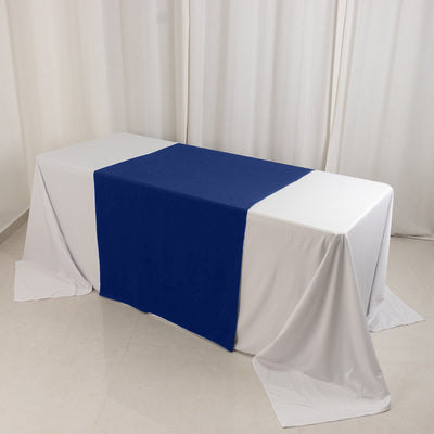 Table covered with white and navy blue tablecloths in a studio setting