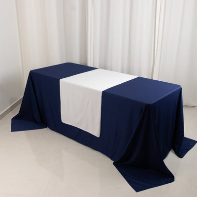 Navy tablecloth with white center panel on a table