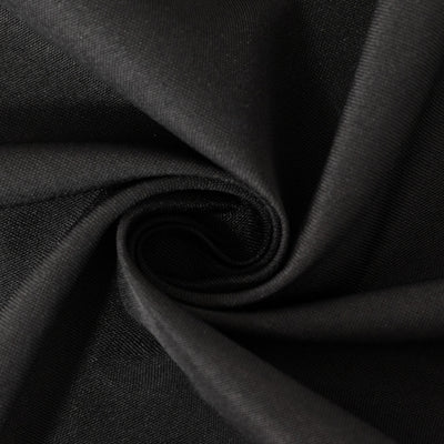 Black fabric texture in a close-up shot.