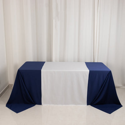 Rectangular table covered with navy and white tablecloth