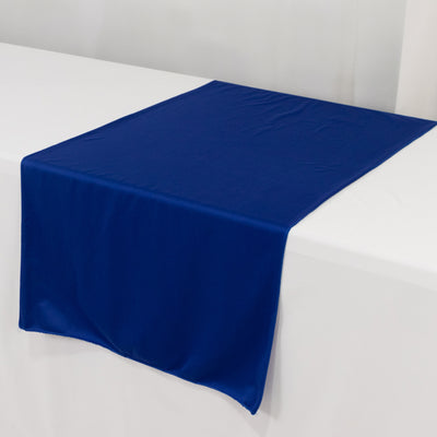 Blue table runner on a white table setting.