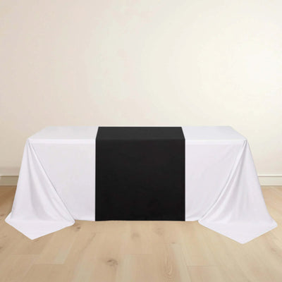 Black and white table runner on a white tablecloth