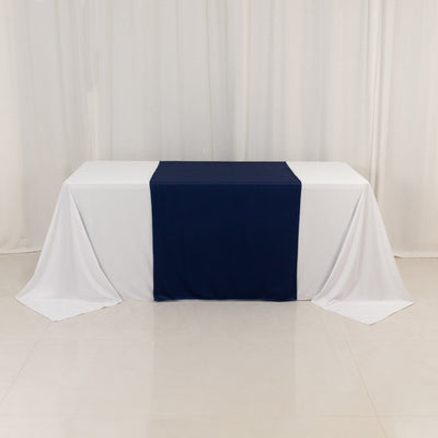 Navy and white tablecloth draped over a table in a studio setting
