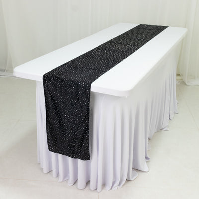 Black polka dot table runner on a white tablecloth