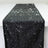 Black table runner with sparkling silver dots and glitter accents.