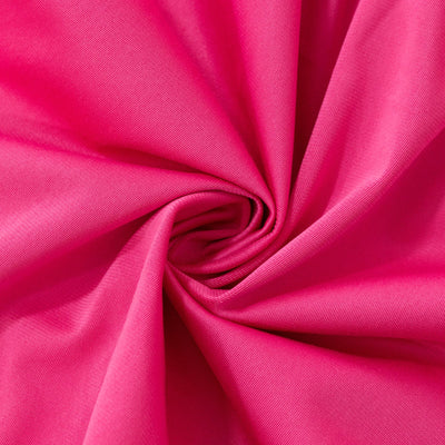 Pink fabric swirl showcasing smooth texture and vibrant color.