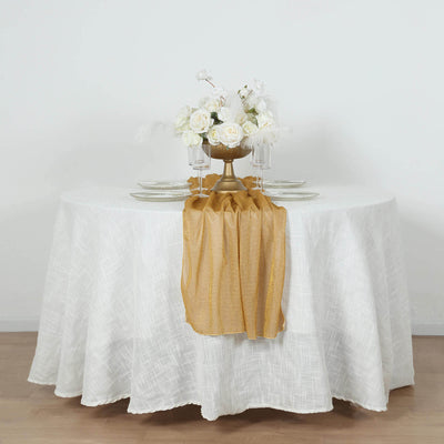 Elegant table setting with gold accents and floral centerpiece.