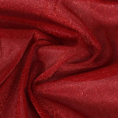 Red glitter fabric with a shimmering texture.