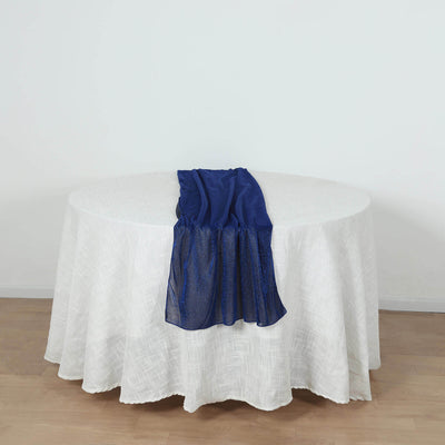 Navy blue sheer scarf draped on a round white tablecloth