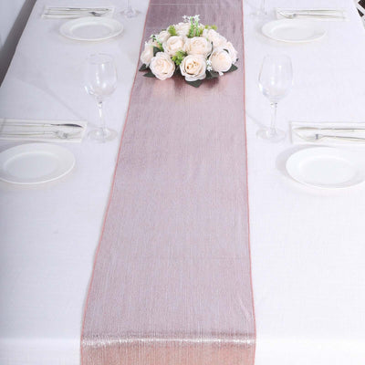 Elegant table runner with floral centerpiece on a dining table setting.