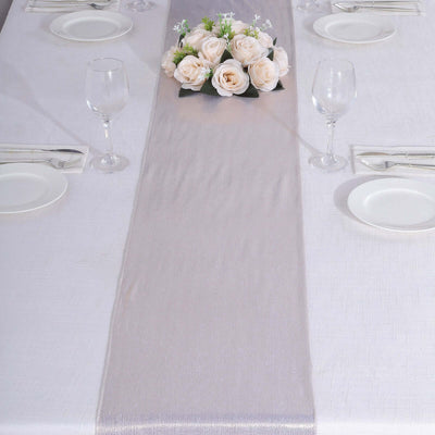 Elegant table setting with a floral centerpiece and glassware.