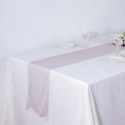 Elegant lavender table runner on a white tablecloth