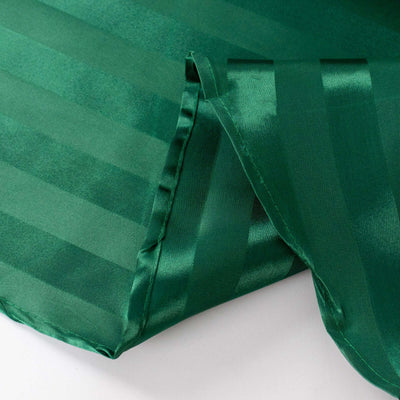 Green satin fabric with a striped pattern and smooth finish.