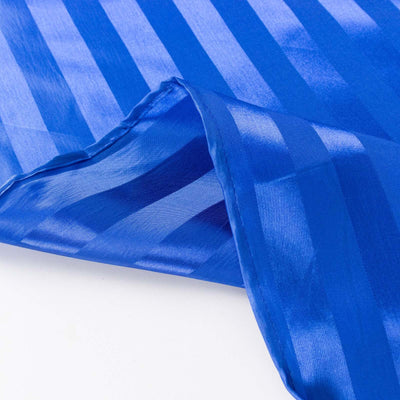 Blue satin fabric with a striped pattern and smooth texture.